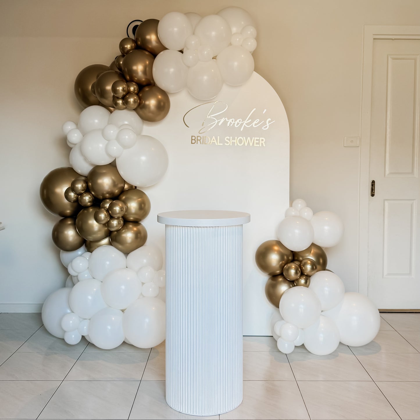 1.8m Plain Arch Backdrop with 2.5m Garland, Vinyl Decal & 90cm Ripple Plinth - HIRE ONLY