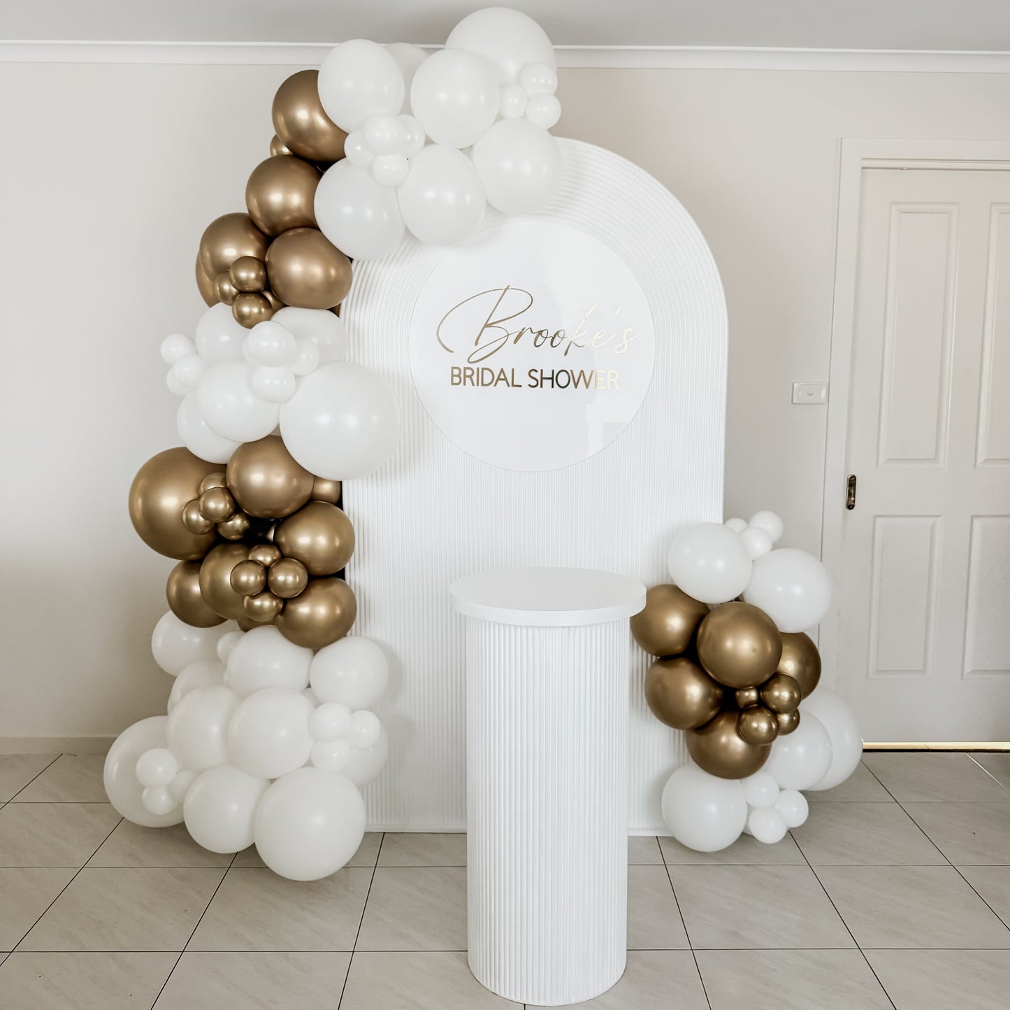 2m Ripple Arch Backdrop with 3m Garland, 70cm Personalised Disc & 90cm Ripple Plinth - HIRE ONLY